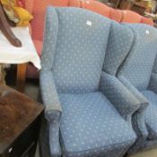A blue wing armchair