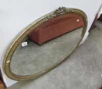 A bevel edged oval mirror