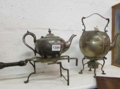 A Pewter kettle on stand, teapot and trivet
