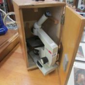 A cased microscope