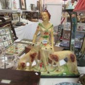 A Deco figure with dogs