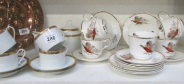 A Limoges part tea set and a pheasant pattern part tea set