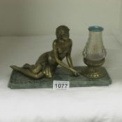 A Deco figure on marble base