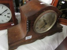 An oak mantel clock