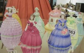 7 Coalport figures and a Coalport cottage