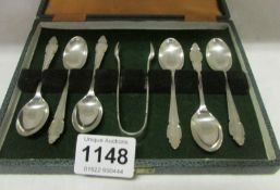 A cased set of 6 silver teaspoons with silver tongs