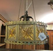 A brass and amber glass ceiling light