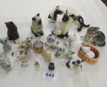 A Royal Doulton Siamese cat and other cats