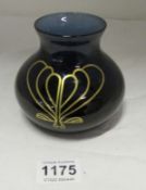 A Caithness vase with 22ct motif