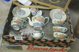 A doll's tea set and an Escalado game