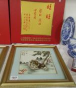 A cased and framed painting of Pekinese dogs on porcelain by Chao-Ai-Qin