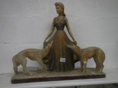 A Deco chalk figure of girl with dogs