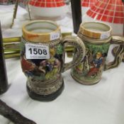 A muscial beer stein and one other