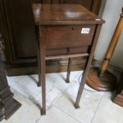 A mahogany sewing table