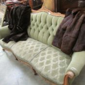 A wood framed French style sofa