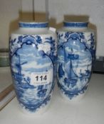 A pair of Delft blue and white vases
