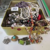 A mixed lot of costume jewellery including silver brooch