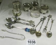 5 silver napkin rings and one other and a quantity of silver spoons including 800