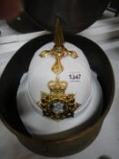 A 1960's Devonshire & Dorset Bandsman's helmet in tin