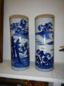 A pair of hand painted blue and white cylinder vases (30cm)