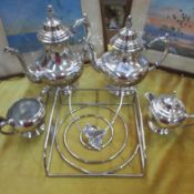 A silver plate tea set and one other item