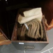 A wooden box of old rope etc
