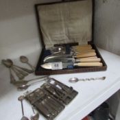 A quantity of silver plate cutlery and a medical kit
