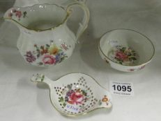 A Royal Crown Derby jug, tea strainer and bowl