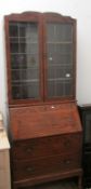 An oak bureau bookcase