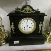 A Victorian black slate mantel clock