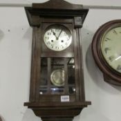 A 1930's oak wall clock