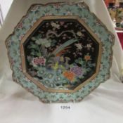An Oriental oxagonal plate decorated with Japanese ornamental pheasants