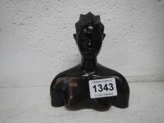 A carved wood African bust