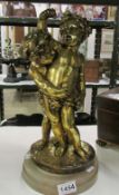 A figure of 2 cherubs on marble base