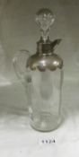 A silver topped claret jug