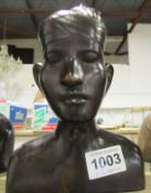 A carved wood African bust