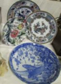 A blue and white Oriental plate and 3 others