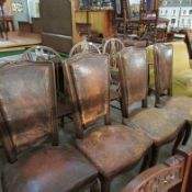 A set of 4 Cabriole leg Leather covered chairs