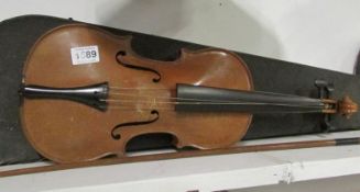 A cased violin and bow