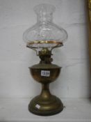 An Edwardian oil lamp complete with shade