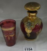 A gilded ruby glass decanter and beaker