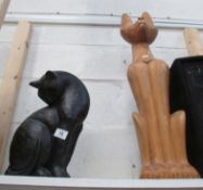 A large wooden cat and one other