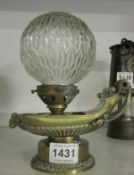 A 19th century brass urn oil lamp converted to electric