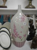 A tall Oriental style flask/vase