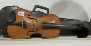 A cased violin and bow