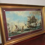 A large gilt framed print of a 15/16C battle scene by L A Wilcox