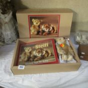 A boxed Steiff bear and book