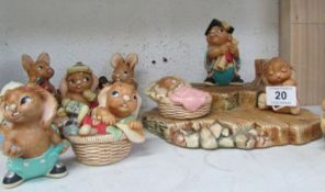 A Pendelfin stand and 10 Pendelfin rabbits