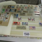 A stamp album and stamps including penny reds