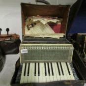 A cased piano accordian